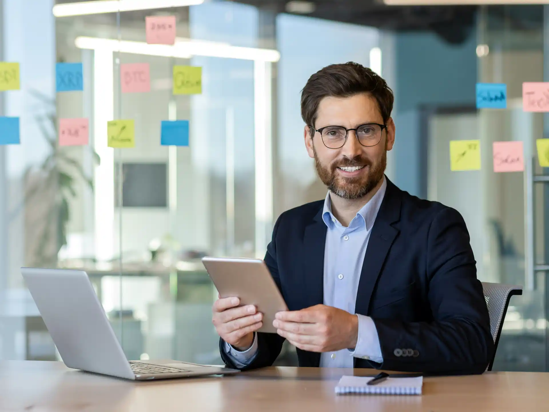 Smiling businessman because of good results from website by Centrix